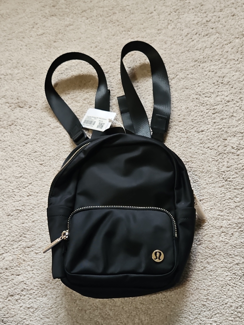 lululemon athletica Black Mini Backpack with Gold Accents